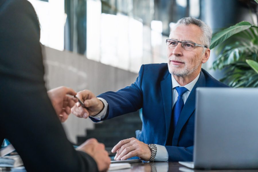 senior-and-young-businessmen-having-a-meeting-in-o-2025-01-09-05-41-56-utc